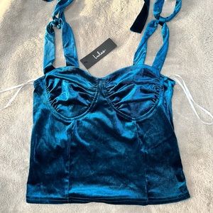 Stunning with tags, blue crop top with tie straps